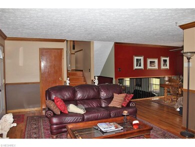 The living room also has crown molding and opens t