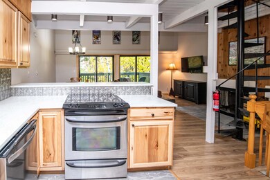 Updated kitchen with stainless steel appliances and wine fridge