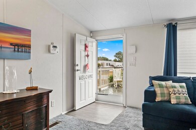 Doorway to outside with a textured ceiling and lig