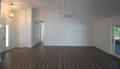 MAIN GREAT ROOM AREA WITH ENTRY TO BEDROOMS AND LA