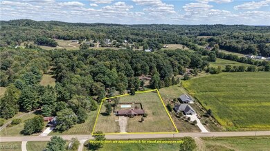 Overview of rural landscape with a forest and property parcel outlined