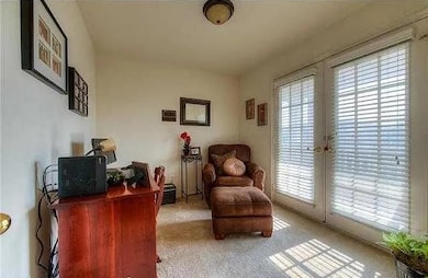 Living area with carpet floors