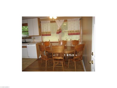 Another view of the dining area overlooking rear fenced yard.