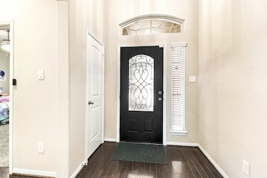 Welcome to this absolutely incredible home! The foyer greets you with a coat closet, and to the left, you'll find a hallway leading to the guest bedrooms and a full guest bathroom.