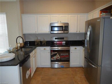 Kitchen: Room features include vinyl plank flooring for easy cleaning, an eat in area behind us, patio door to the backyard and patio, granite counter tops, bright cabinets and all SST appliances. The refrigerator STAYS with the home at closing. The flooring is 20 inch square tile for easy cleaning.