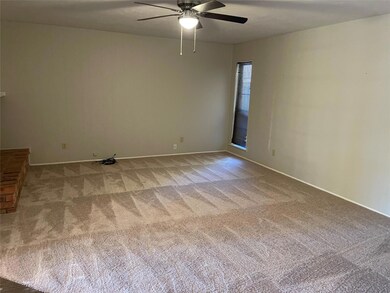 Spacious living area features fireplace