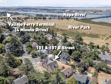 Aerial view of property's location featuring a notable bridge and a large body of water