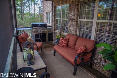 Stained back patio is covered and screened. Offers