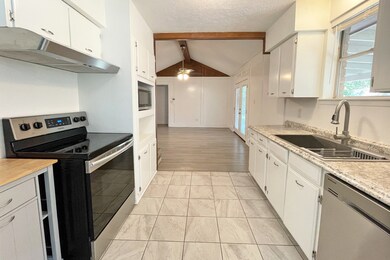 View of the kitchen looking towards the living room.
