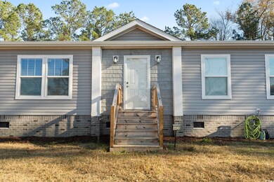 View of front of property featuring a front yard