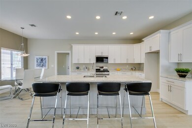 Redesigned kitchen features 4 seat island.