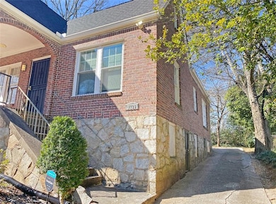View of home's exterior featuring stone siding, br