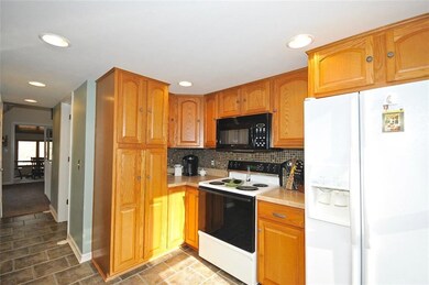 Kitchen has updated vinyl floors and newer countertops