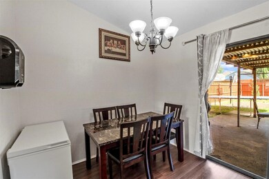 Dining room featuring an inviting chandelier, loft