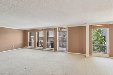 Living room with a door leading you out to the balcony.