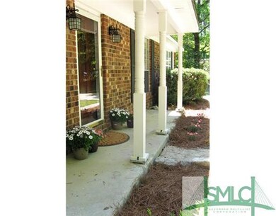 Exterior Front. Long sit-a-spell front porch.  New