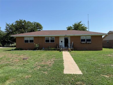 Ranch-style house with brick siding, a front yard, and crawl space