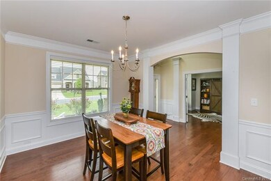 Formal dining room with beautiful moldings and woo