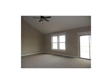 Great room, ceiling fan and vaulted ceiling