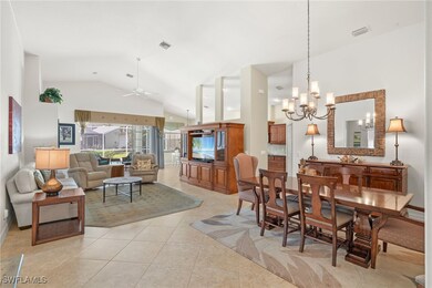 Dining area featuring high vaulted ceiling, light