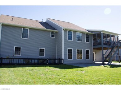 The wonderful screened in balcony overlooks a pretty great lot!