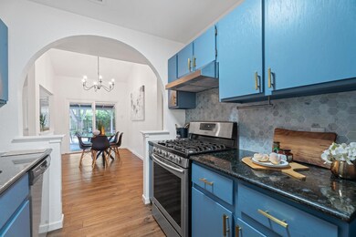 Kitchen with stainless steel appliances, blue cab