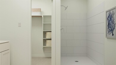 Full bath with a shower stall and vanity