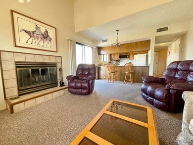 Living area featuring carpet flooring, a tiled fir