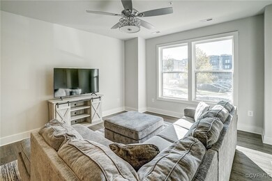 Living room with hardwood / wood-style floors and