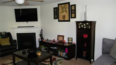 Cozy fireplace central to entire room.
