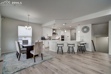 Eating area off open kitchen featuring an inviting