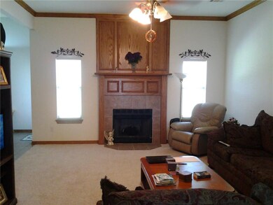 Living Room with beautiful Fireplace & Crown Moldi