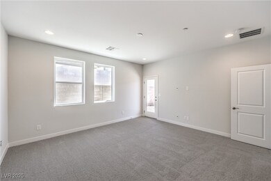 Spare room with light colored carpet and recessed lighting