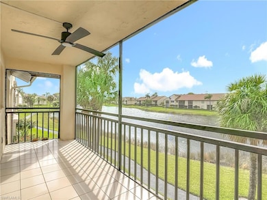 Balcony with a water view, ceiling fan, and a sunroom