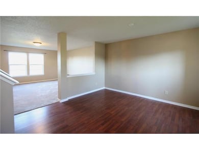 Living Room. As you enter the home, one is met by the beautiful Laminate Flooring in the Formal Living Room.  The Open Floor Plan this home has to offer allows for easy entertaining!