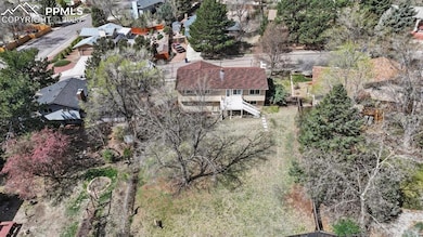 Aerial rear view of home and backyard.