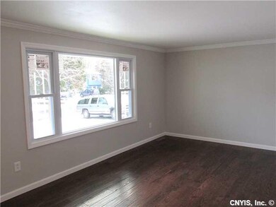 Living Room. CROWN MOLDING AND BEAUTIFULL HARDWOODS....
