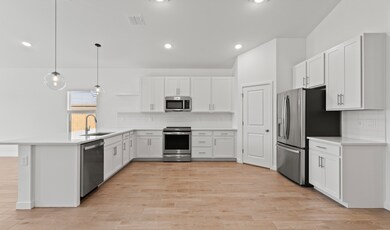 Kitchen with stainless-steel appliances
