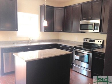 kITCHEN WITH GRANITE COUNTER TOPS AND STAINLESS ST