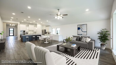 Living room featuring a ceiling fan, dark wood-st