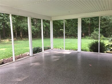 Wonderful screened in porch overlooking the back y