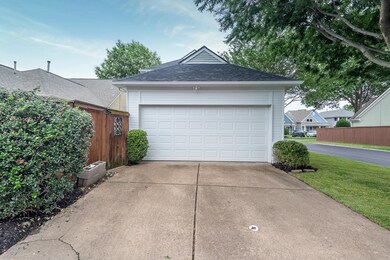 Garage featuring driveway