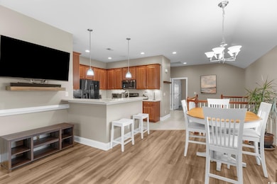 Dining area with light hardwood / wood-style floor