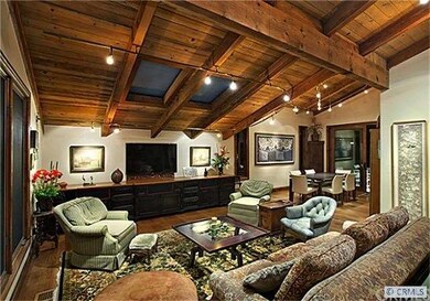 Expansive ceilings and remodeled floor plan give c