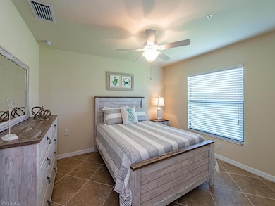 Dining room with crown molding, light tile pattern