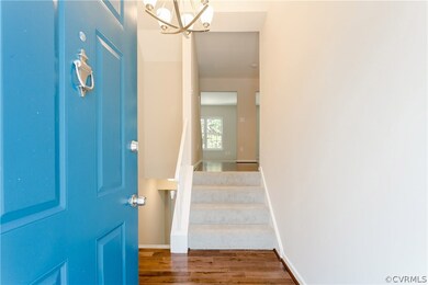 Foyer with new hardwood floors and light fixture