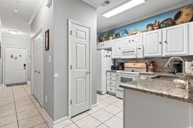 Kitchen featuring visible vents, ornamental moldin