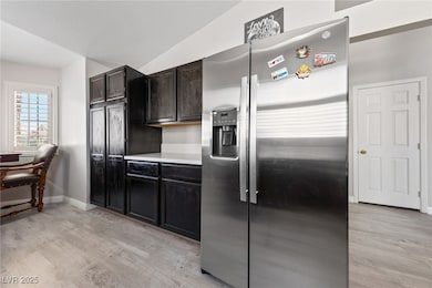 Kitchen with stainless steel fridge with ice dispe