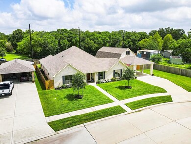 Another view of the property with great curb appeal and sprinkler system.
