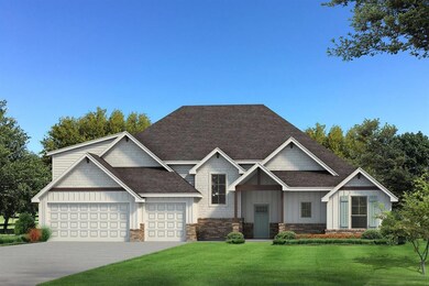 Craftsman house with a garage and a front lawn